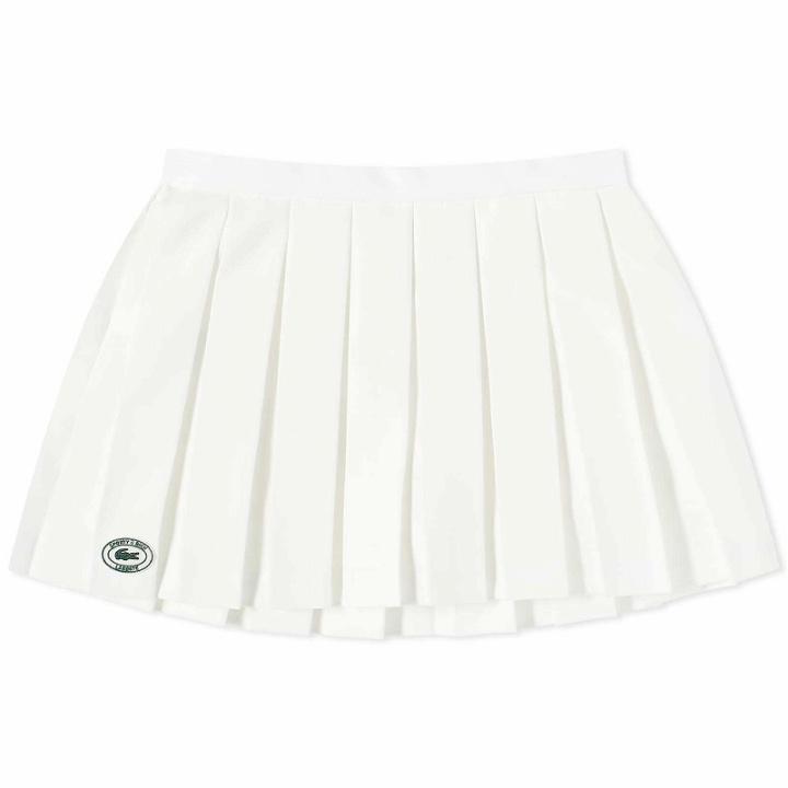 Photo: Sporty & Rich x Lacoste Tennis Pleated Mini Skirt in Farine