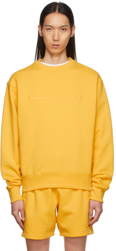 Photo: adidas x Humanrace by Pharrell Williams SSENSE Exclusive Yellow Humanrace Tonal Logo Sweatshirt
