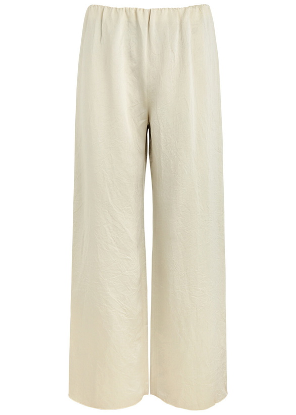 Photo: Nanushka Brenda Crinkled Satin Trousers Ecru
