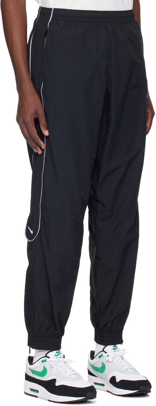 Nike sb track pant swoosh best sale