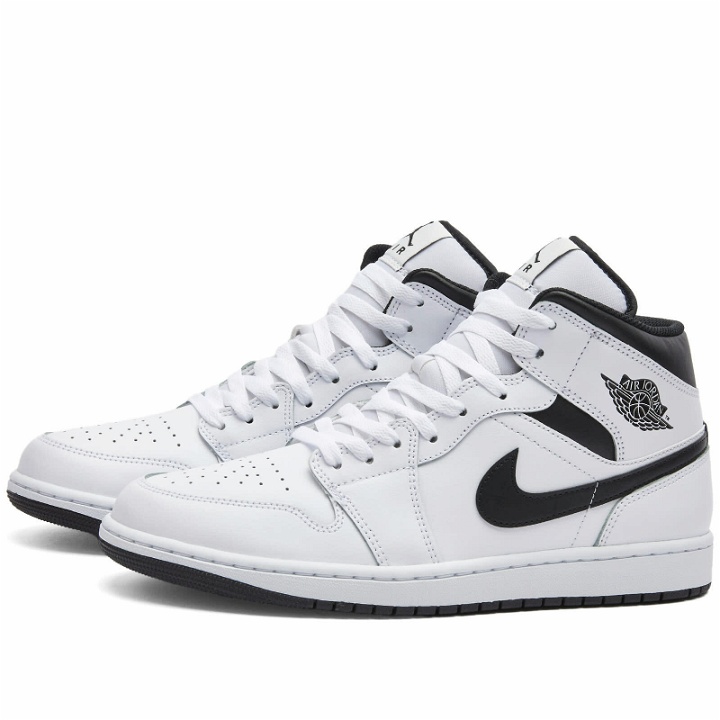 Photo: Air Jordan Men's 1 MID Sneakers in White/Black