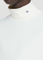 Pleats Please Issey Miyake R-Embroidered Turtleneck Top