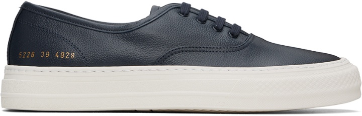 Photo: Common Projects Navy Four Hole Sneakers