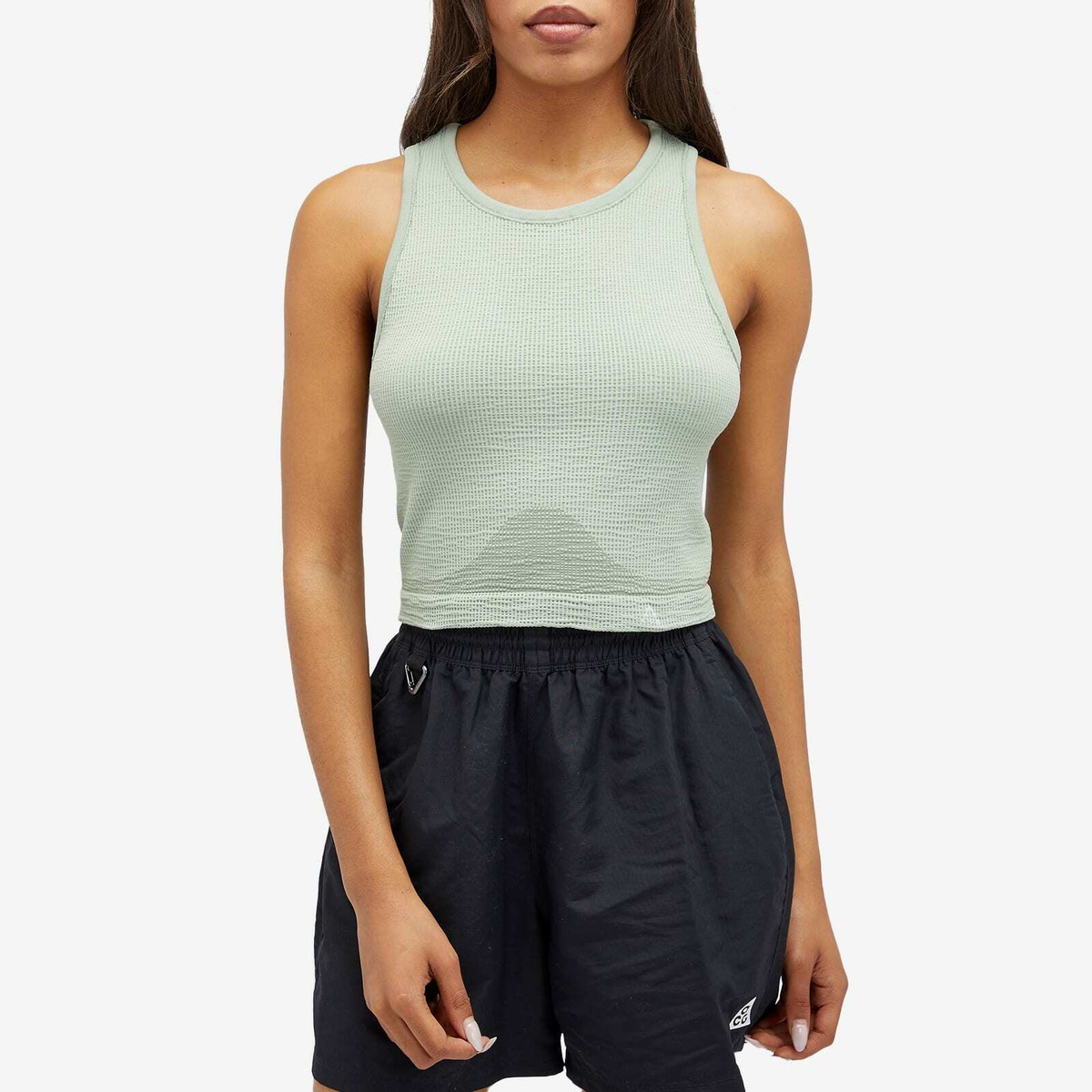 Nike Women's ACG DLTA BSLR Tank Top in Jade Horizon/Guava Ice