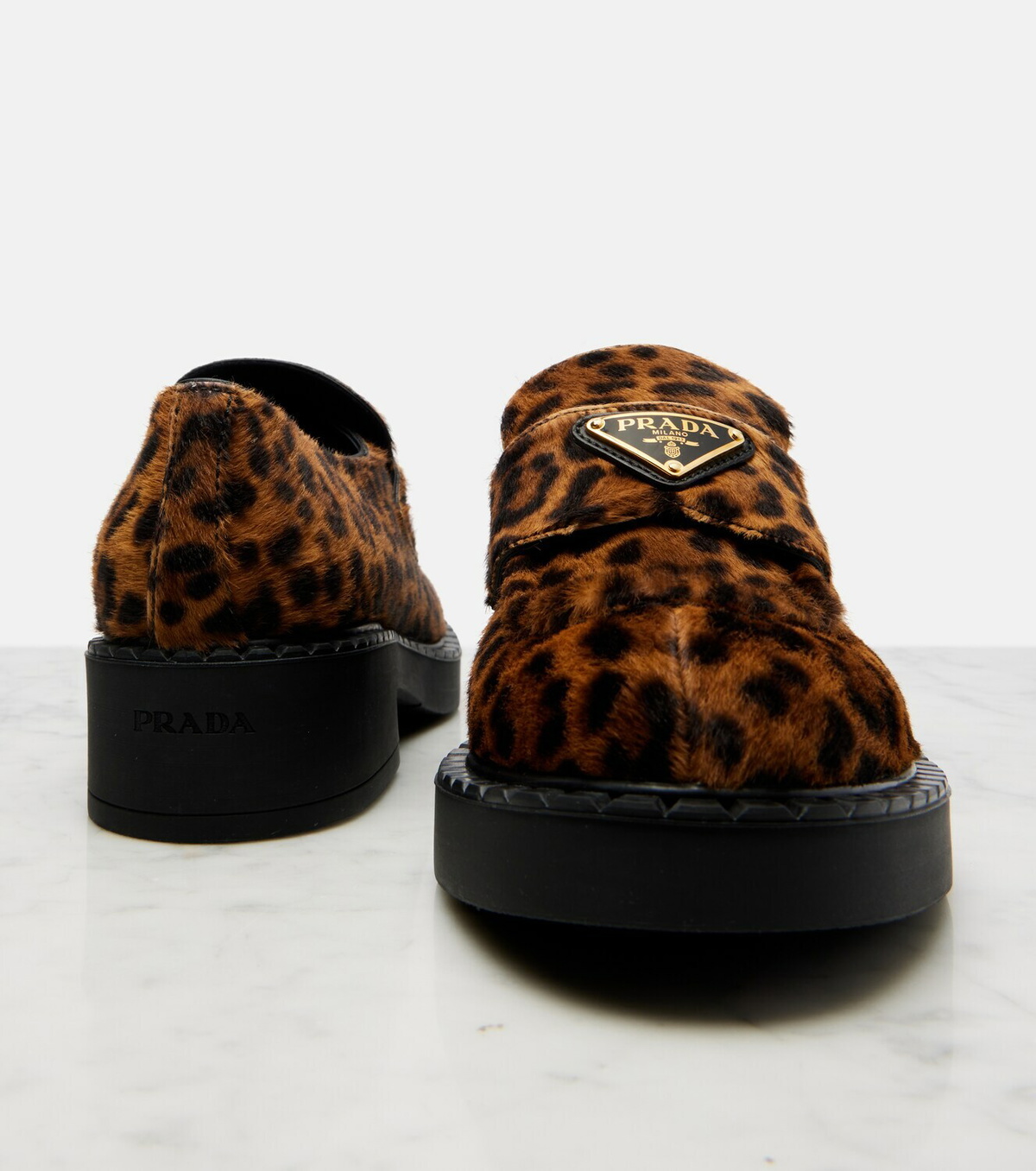 Prada Leopard-print calf hair penny loafers