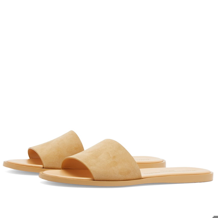 Photo: Woman by Common Projects Women's Suede Slides in Tan