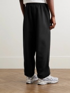 Nike - Solo Swoosh Tapered Logo-Embroidered Cotton-Blend Jersey Sweatpants - Black