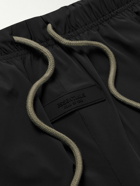 FEAR OF GOD ESSENTIALS - Tapered Logo-Appliquéd Shell Sweatpants - Black