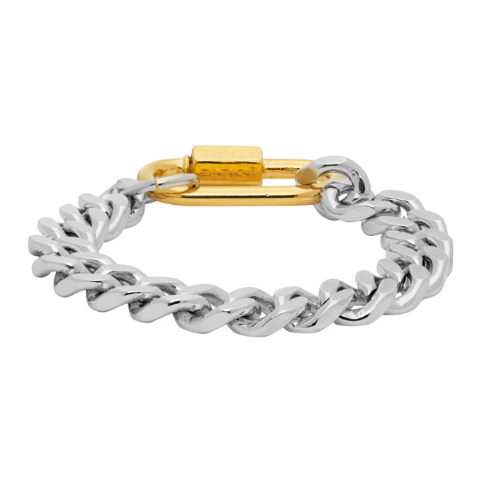 Photo: IN GOLD WE TRUST Silver and Gold Cuban Link Bracelet