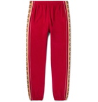 Gucci - Tapered Logo-Appliquéd Webbing-Trimmed Piped Velvet Sweatpants - Red