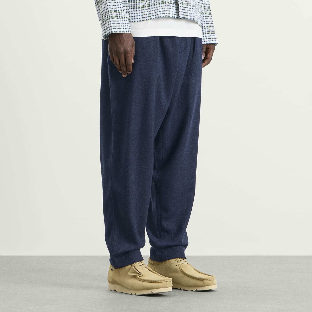 Universal Works Men's Wool Herringbone Pleated Track Pant in Navy