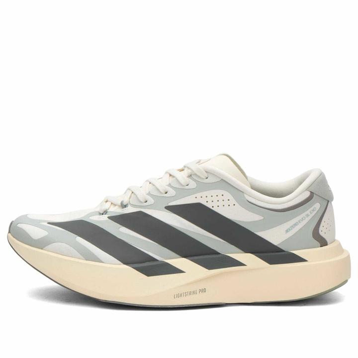 Photo: Adidas Women's Adizero Evo Sl Exo Sneaker in Cloud White/Grey Four/Wonder Silver