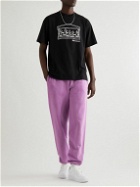 Aries - Tapered Logo-Print Tie-Dyed Cotton-Jersey Sweatpants - Pink