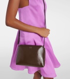 Khaite Lina patent leather crossbody bag
