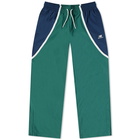 New Balance Men's Hoops Woven Pant in Team Forest Green