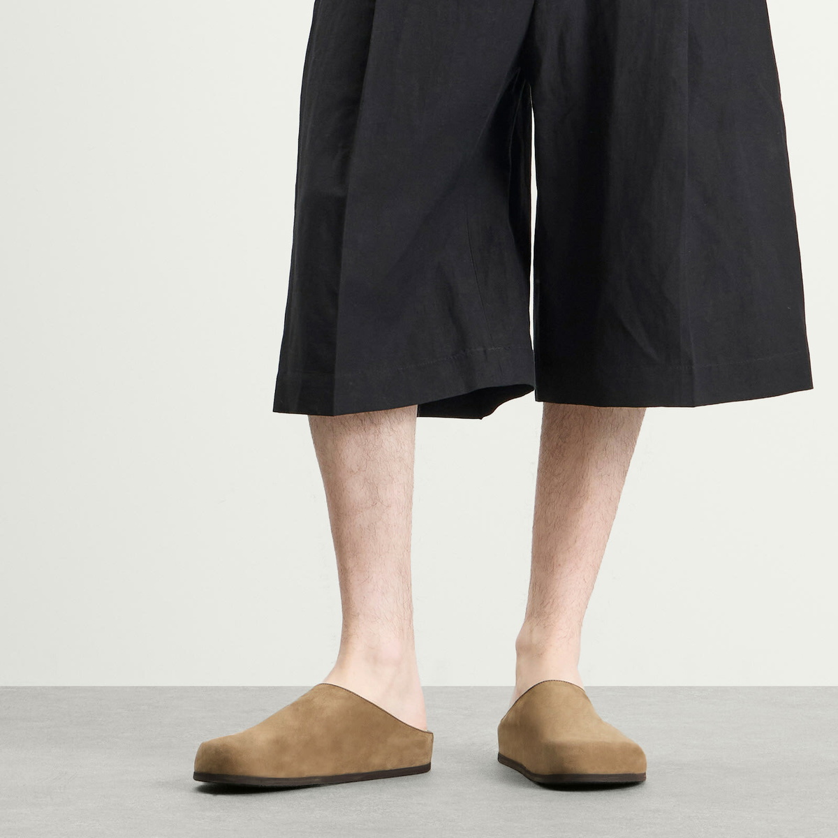 Studio Nicholson Men's Wearing Slip On Clog in Taupe