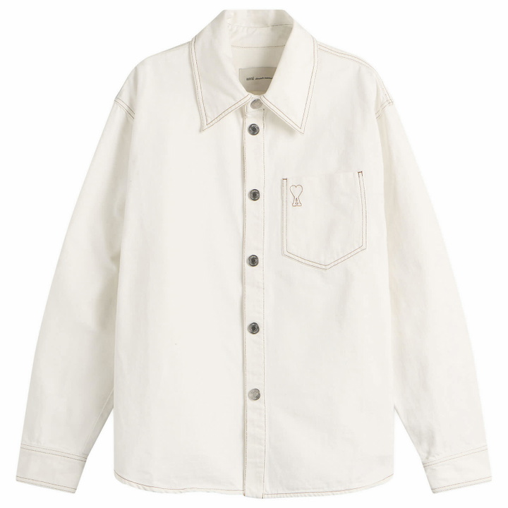 Photo: AMI Paris Men's Ami De Coeur Light Denim Overshirt in Blanc Creme