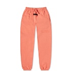 Fear of God ESSENTIALS Kids Logo Sweat Pant in Coral