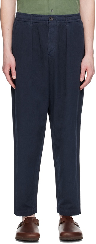 Photo: Universal Works Navy Pleated Trousers