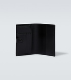 Gucci - GG embossed passport holder