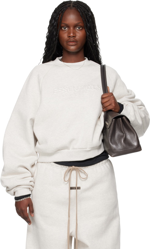 Photo: Fear of God ESSENTIALS Gray Holiday Embossed 90s Raglan Crewneck Sweatshirt