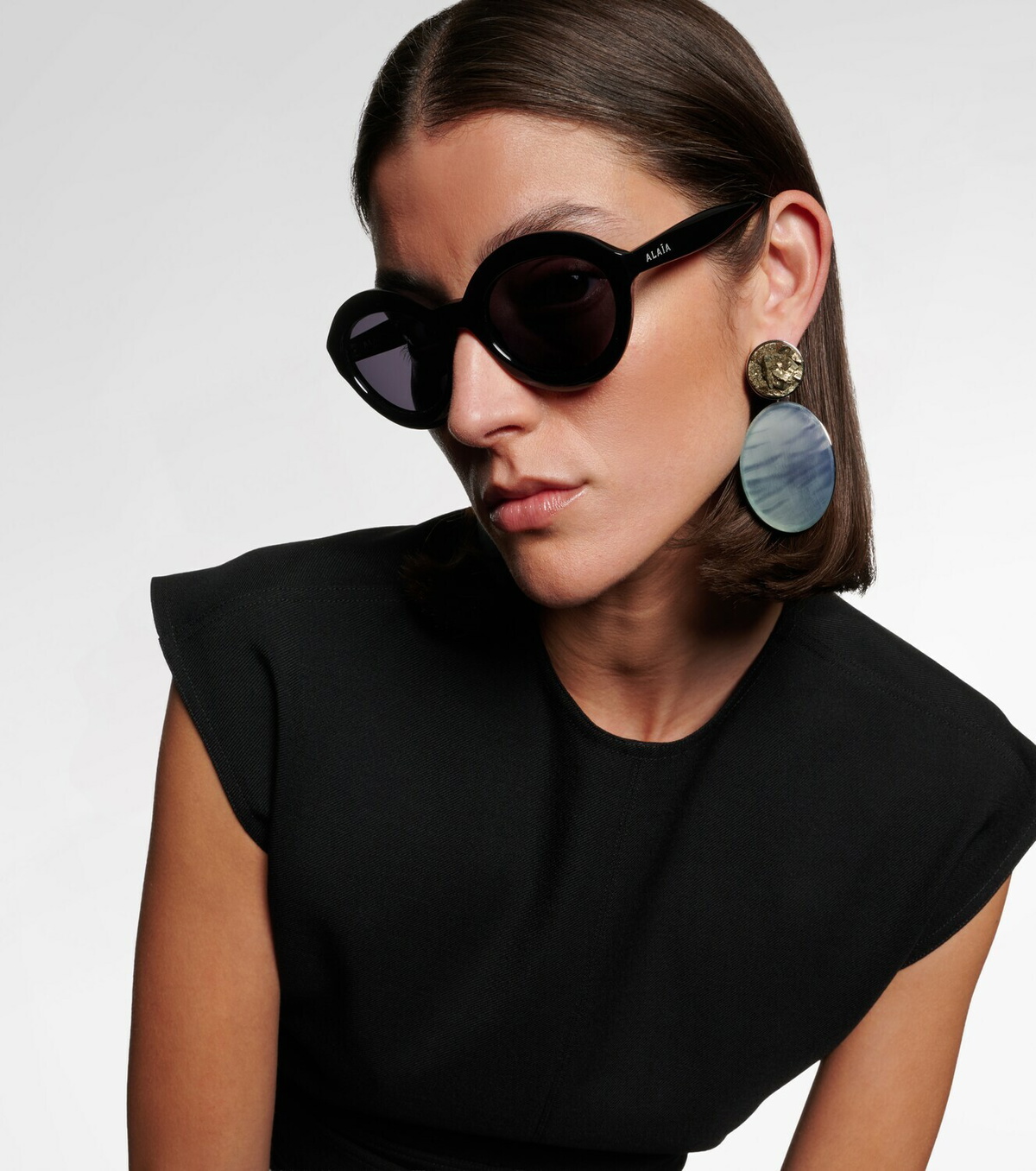 Alaïa Lettering Logo round sunglasses