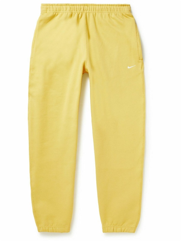 Photo: Nike - Solo Swoosh Tapered Logo-Embroidered Cotton-Blend Jersey Sweatpants - Yellow