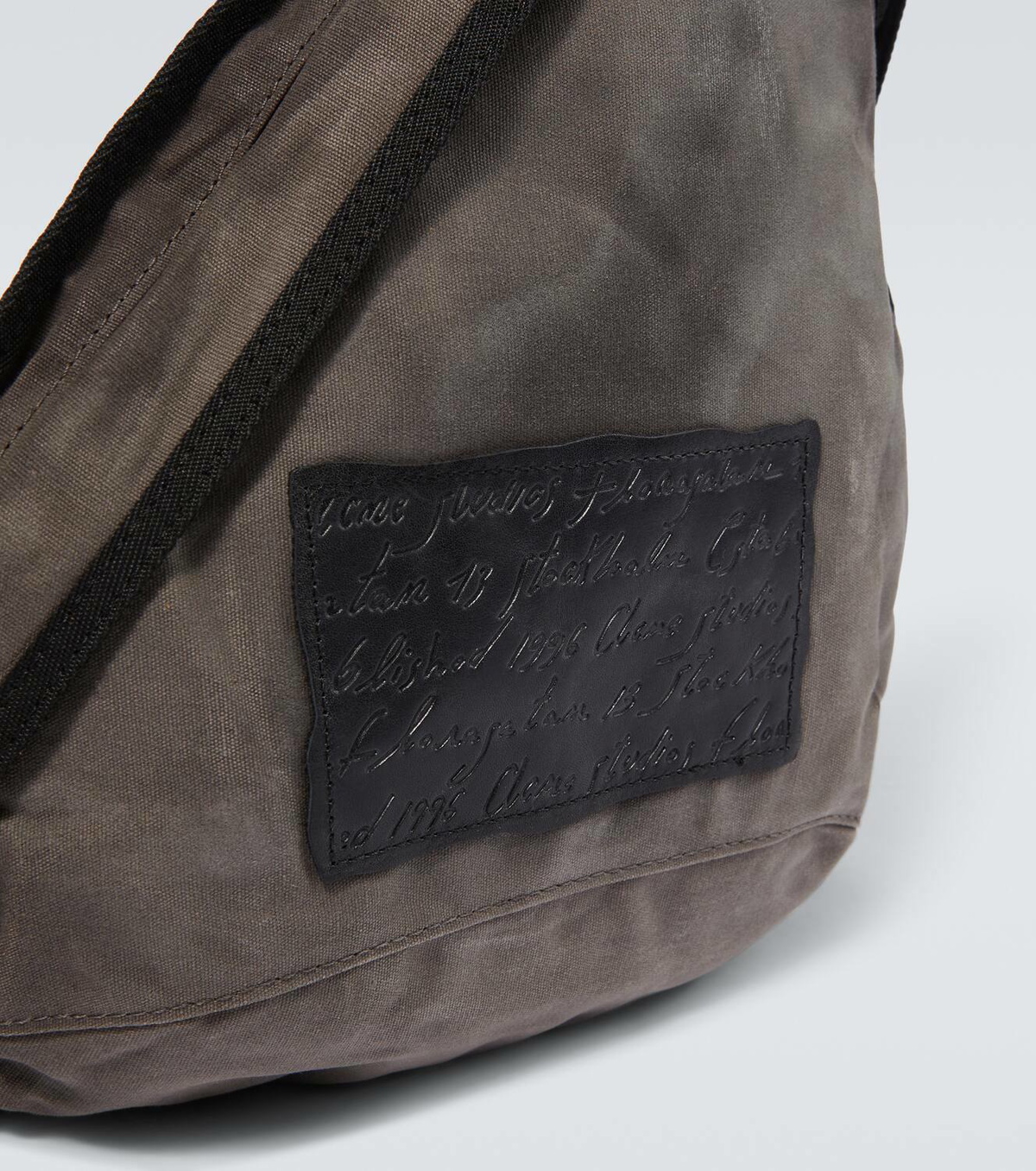 Acne Studios Sling leather-trimmed canvas backpack