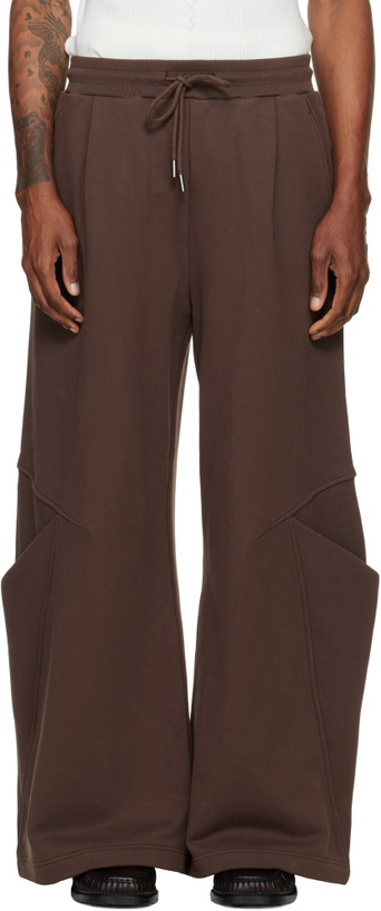Photo: NULLUS Brown Sculptural Cut Wide Leg Sweatpants