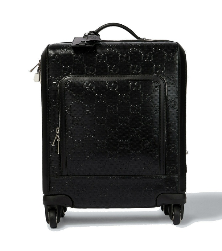 Photo: Gucci - GG embossed Small carry-on suitcase