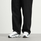 Nike Nocta Glide Sneaker in White/Black/Gold