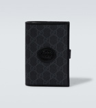 Gucci - GG embossed passport holder