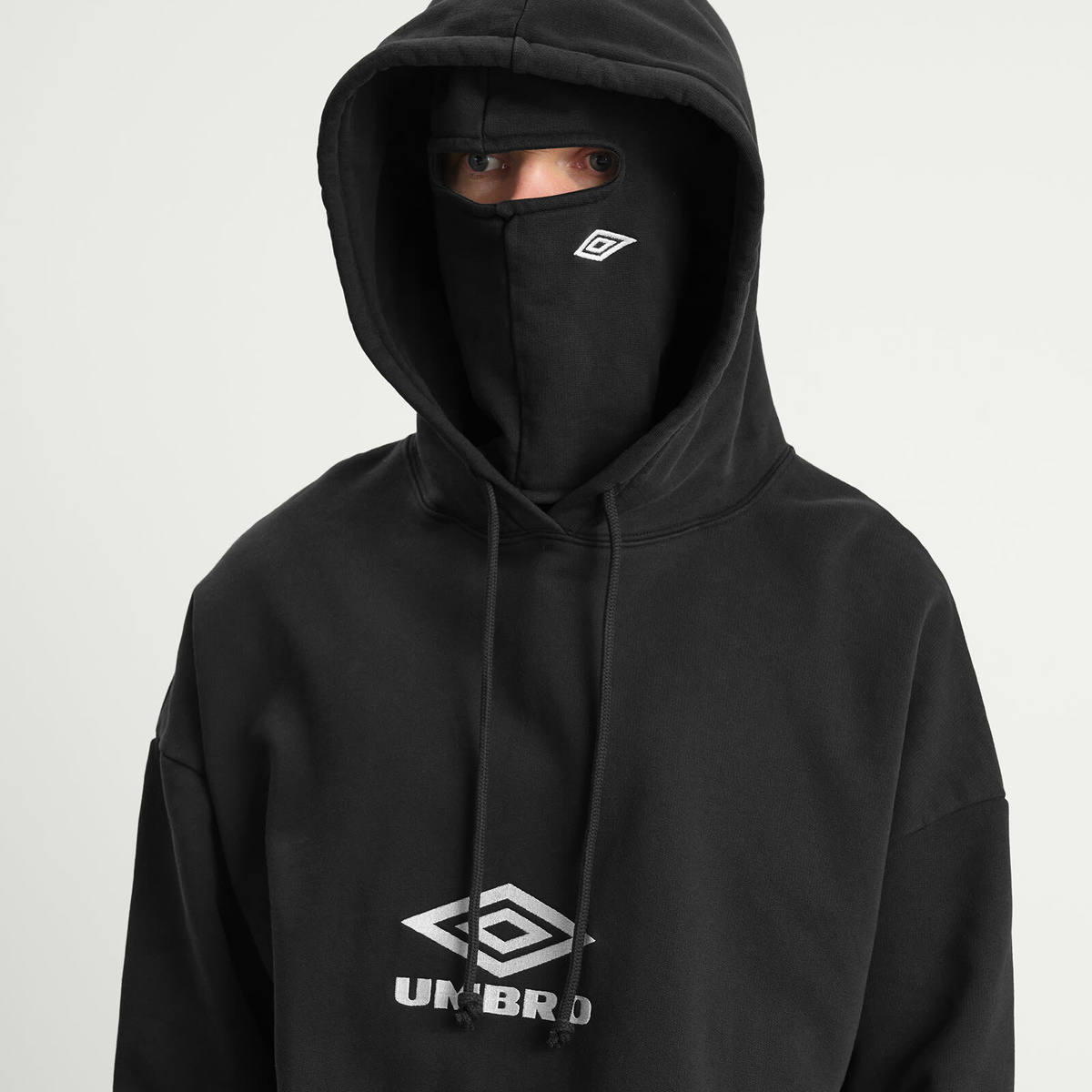 Umbro by Slam Jam Men's OG Logo Mask Hoodie in Washed Black