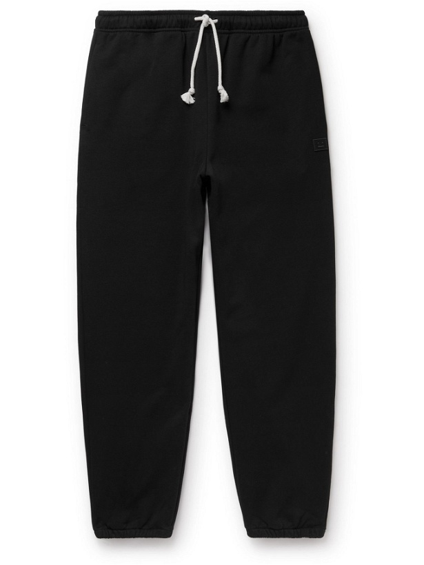 Photo: ACNE STUDIOS - Tapered Logo-Appliquéd Cotton-Jersey Sweatpants - Black