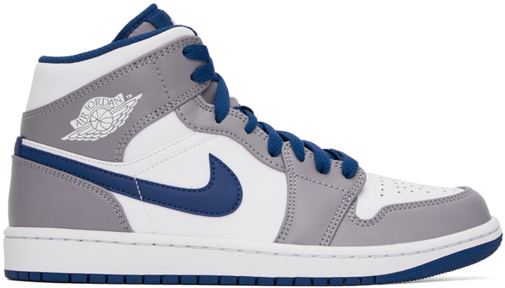 Photo: Nike Jordan Gray & White Air Jordan 1 Mid Sneakers