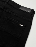 AMIRI - MX1 Skinny-Fit Panelled Distressed Jeans - Black