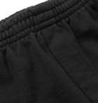 Vetements - Tapered Printed Fleece-Back Cotton-Jersey Sweatpants - Black