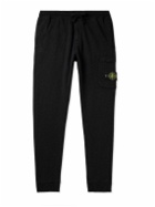 Stone Island - Tapered Logo-Appliquéd Garment-Dyed Cotton-Jersey Sweatpants - Black