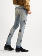 AMIRI - Skinny-Fit Appliquéd Distressed Jeans - Blue