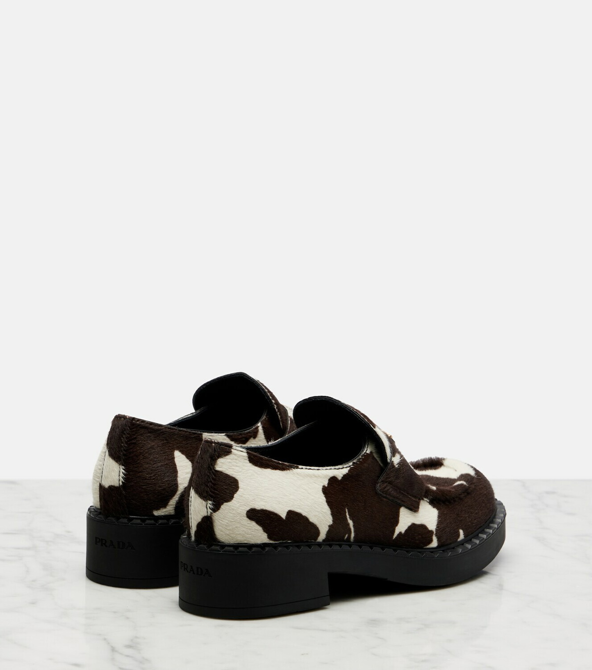 Prada Chocolate cow-print calf hair loafers