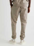 FEAR OF GOD ESSENTIALS - Slim-Fit Tapered Logo-Flocked Cotton-Blend Jersey Sweatpants - Brown