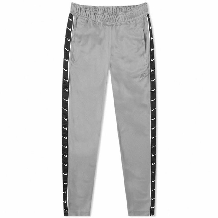 Photo: Nike Taped Poly Track Pant