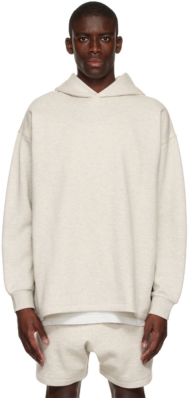 Photo: Fear of God ESSENTIALS Off-White Relaxed Hoodie
