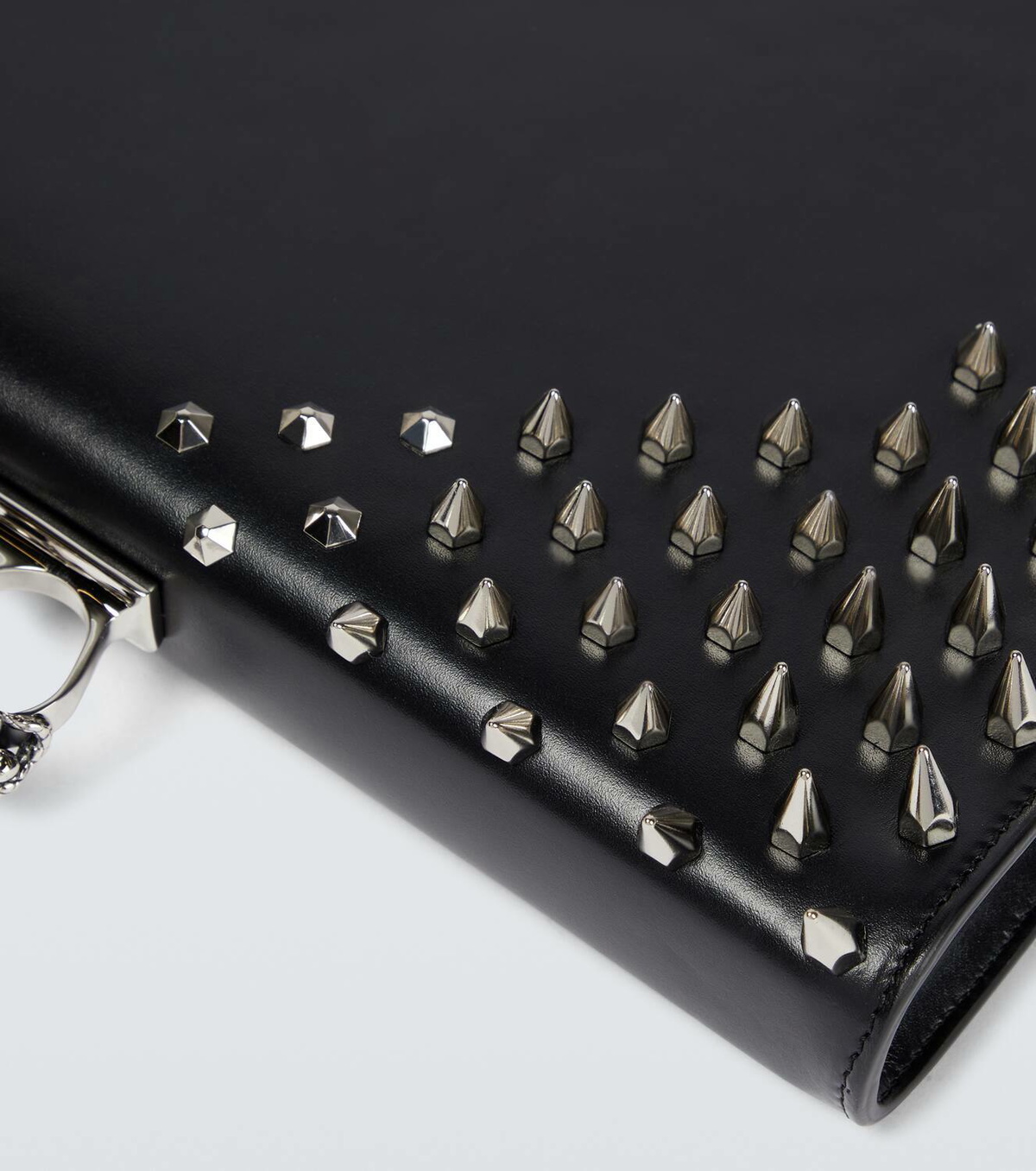 McQueen Four-Ring embellished leather clutch