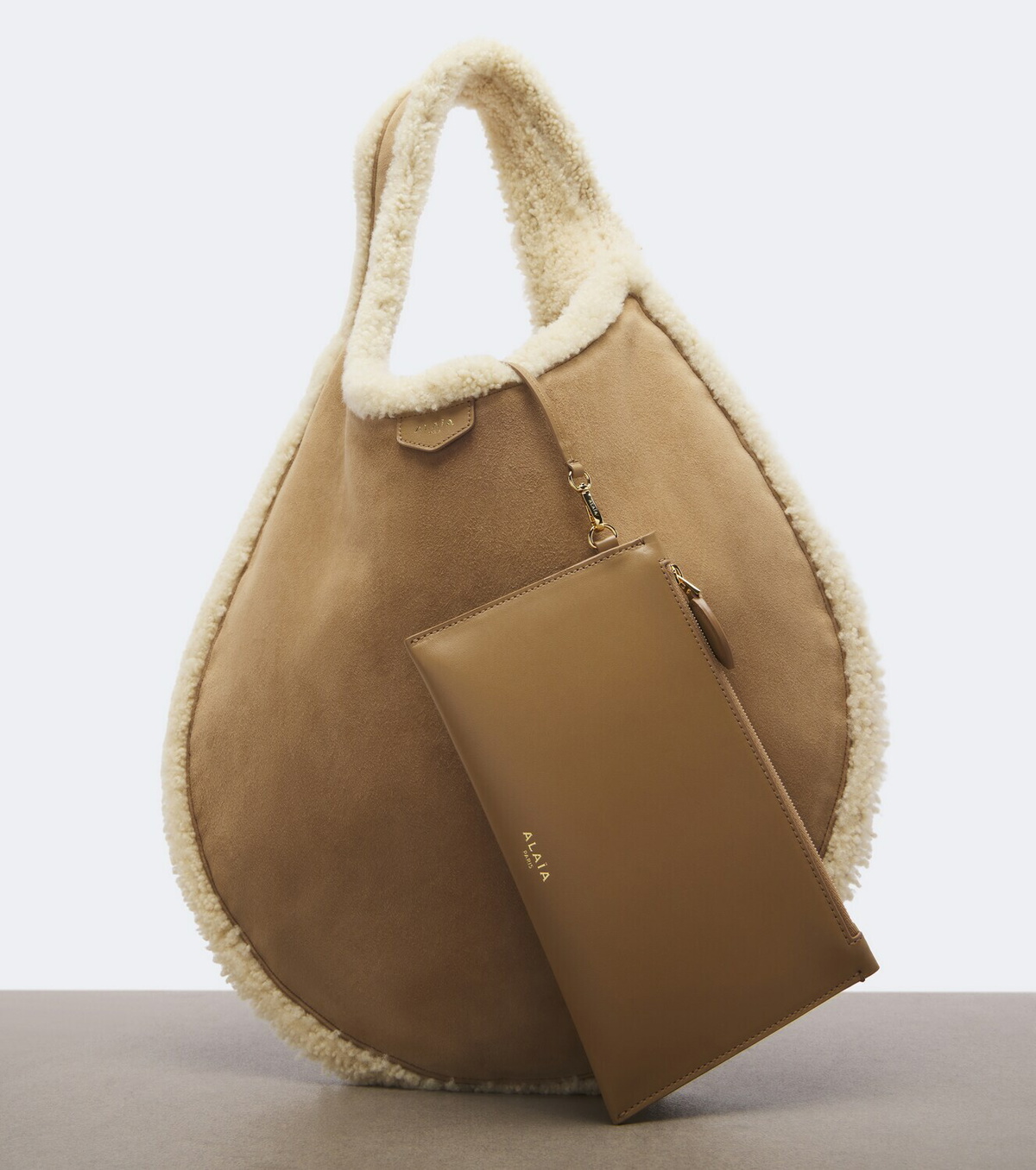 Alaïa One Piece shearling-lined suede shoulder bag