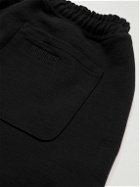 VETEMENTS - Tapered Logo-Print Cotton-Blend Jersey Sweatpants - Black