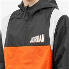 Nike Men's Air Jordan Flight Hooded Woven Jacket in Black/Rush Orange