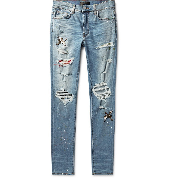 Photo: AMIRI - Skinny-Fit Appliquéd Distressed Stretch-Denim Jeans - Light blue