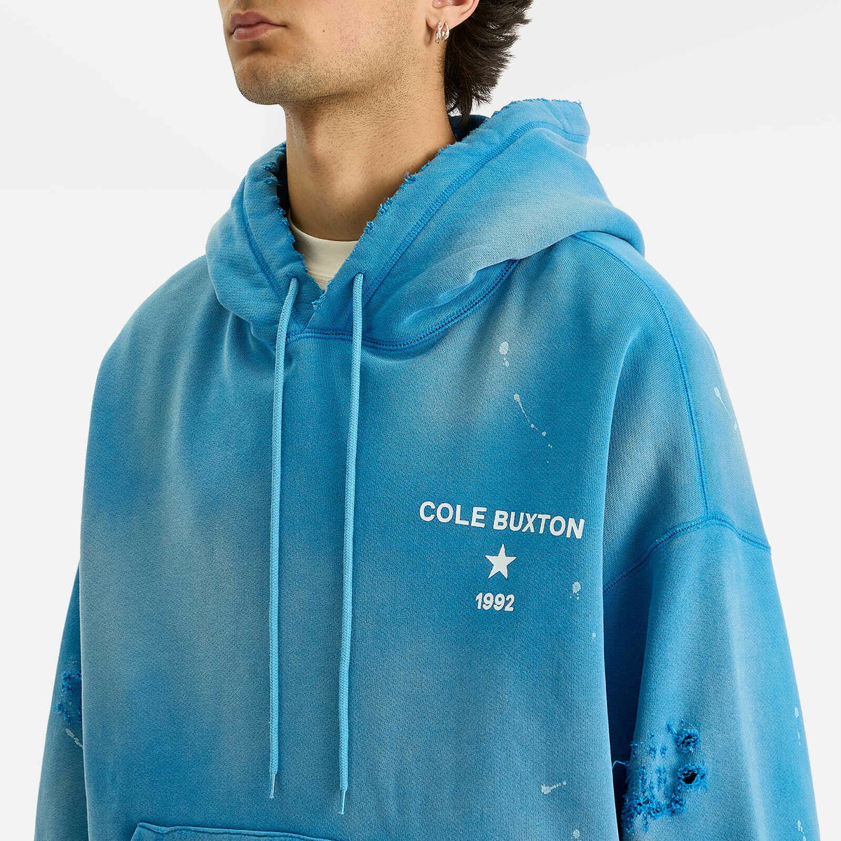 Cole Buxton Men's 1992 Distressed Hoodie in Washed Blue