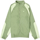 Nike x NOCTA Cardinal Stock Woven Trek Jacket in Oil Green/Light Liquid Lime